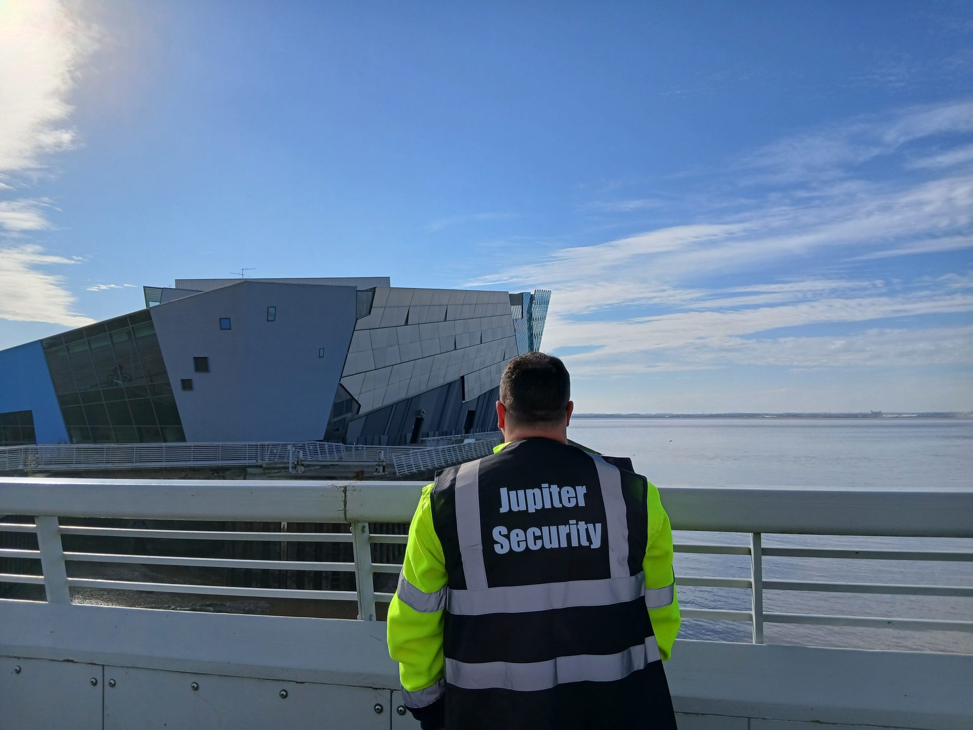 Security guard by modern building