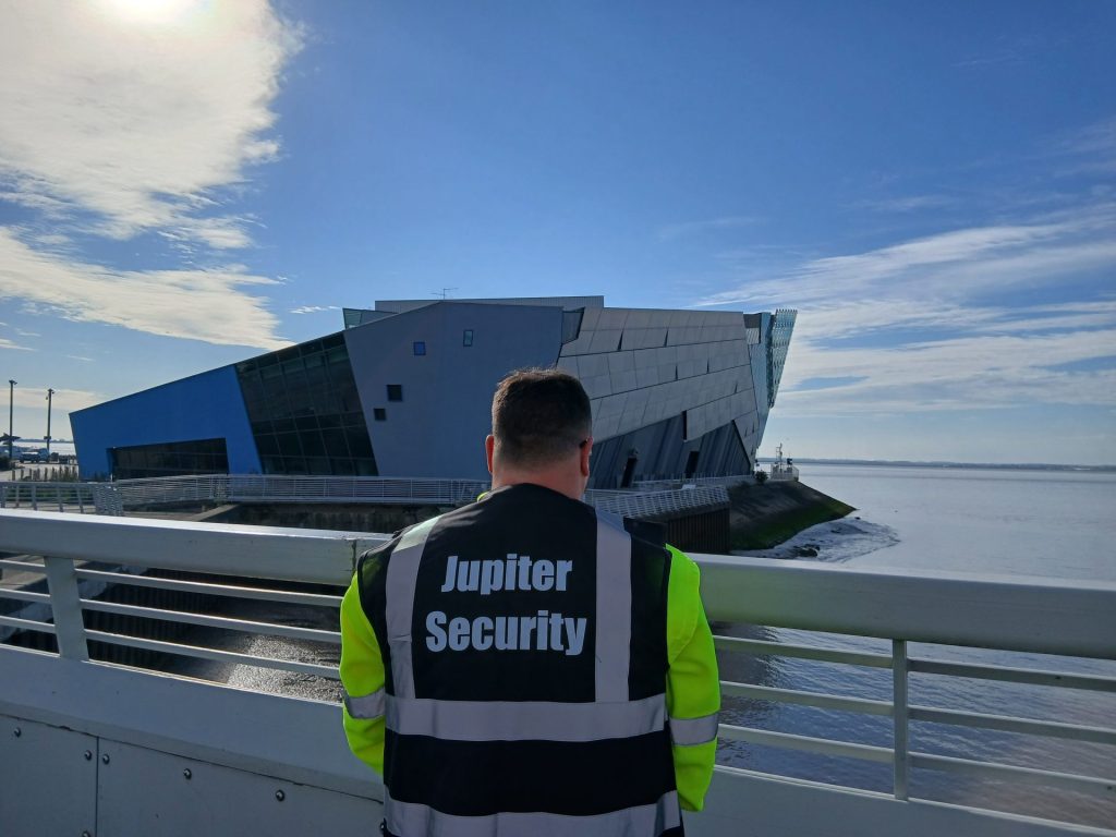 Security guard by modern building